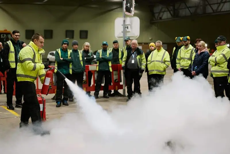 A 1st Choice trainer leading a group fire extinguisher practical